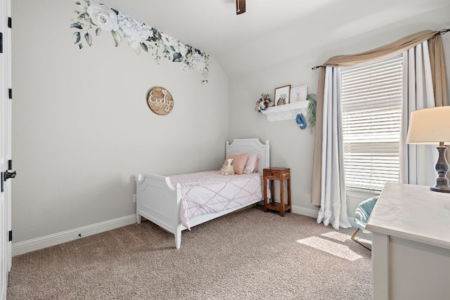 bedroom with multiple windows, light carpet, and vaulted ceiling