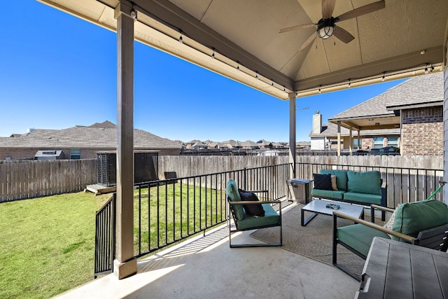 view of patio with a fenced backyard, a residential view, an outdoor hangout area, and ceiling fan