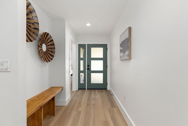 entryway featuring recessed lighting, baseboards, and light wood finished floors