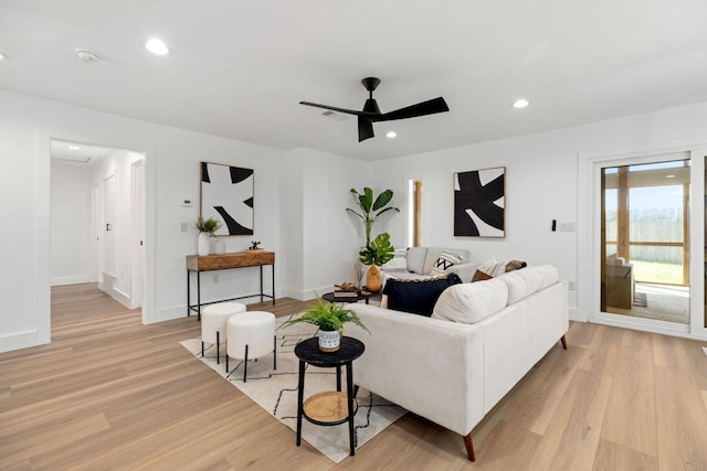 living area featuring recessed lighting, baseboards, light wood-style floors, and ceiling fan