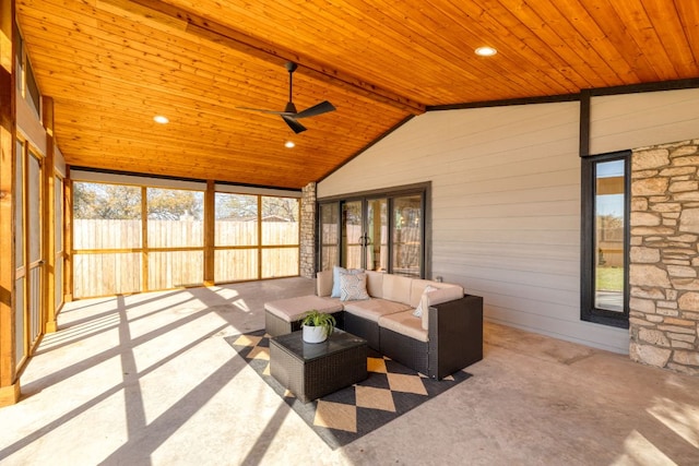 sunroom featuring lofted ceiling, wood ceiling, and a ceiling fan