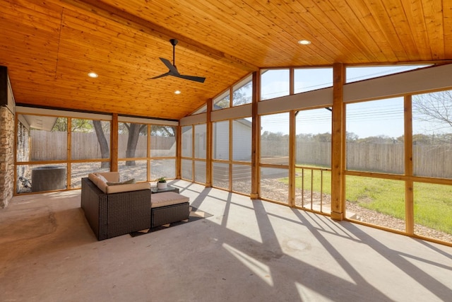 unfurnished sunroom with wood ceiling, lofted ceiling, and a ceiling fan