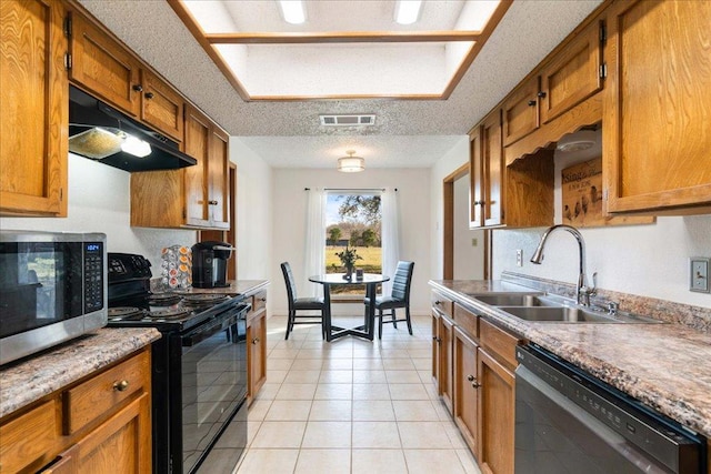 kitchen with visible vents, black range with electric stovetop, under cabinet range hood, stainless steel microwave, and dishwashing machine