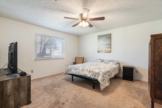 bedroom with baseboards, a textured ceiling, and carpet