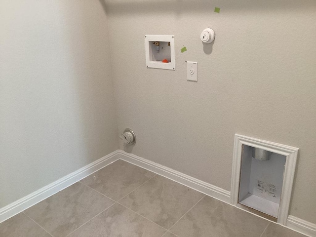 washroom featuring tile patterned flooring, baseboards, gas dryer hookup, hookup for a washing machine, and laundry area