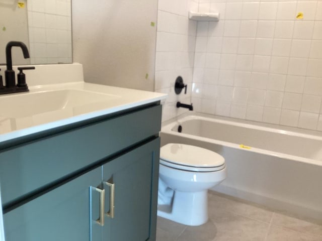 bathroom with tile patterned flooring, washtub / shower combination, toilet, and vanity