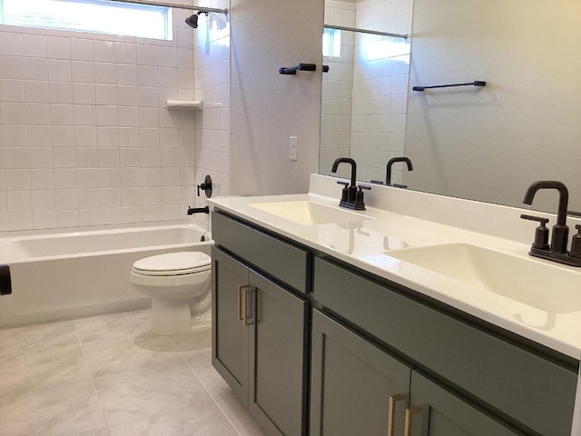 full bath featuring double vanity, toilet, shower / bathtub combination, and a sink