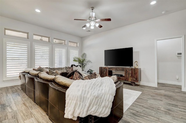 living room featuring recessed lighting, light wood-type flooring, baseboards, and ceiling fan