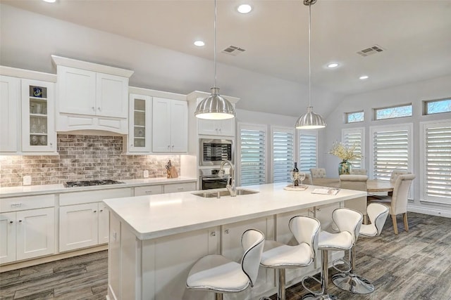 kitchen featuring a sink, visible vents, tasteful backsplash, and appliances with stainless steel finishes