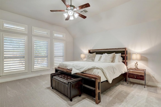 bedroom featuring visible vents, ceiling fan, baseboards, lofted ceiling, and light carpet