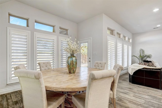 dining space featuring visible vents, recessed lighting, baseboards, and wood finished floors