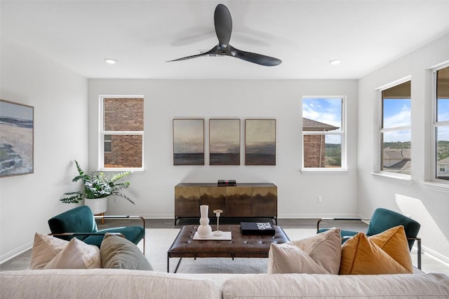 living room with recessed lighting, baseboards, and ceiling fan