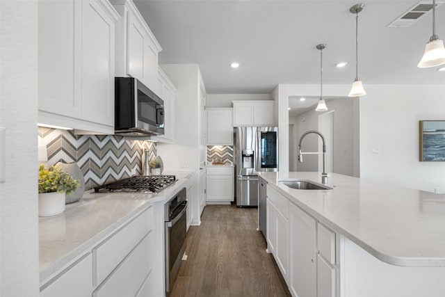 kitchen featuring a sink, visible vents, appliances with stainless steel finishes, and white cabinets