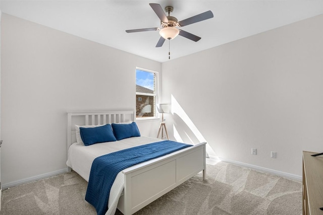 bedroom featuring a ceiling fan, baseboards, and carpet floors