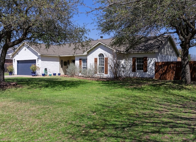 ranch-style house featuring a front yard, an attached garage, and fence