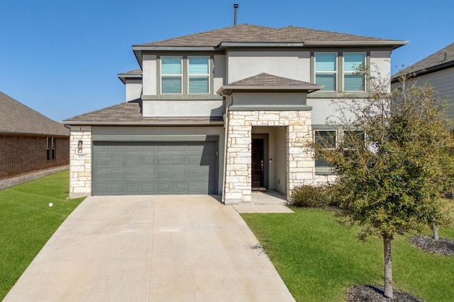 prairie-style house with stucco siding, driveway, stone siding, a front yard, and a garage