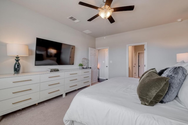 bedroom with visible vents, light carpet, and a ceiling fan