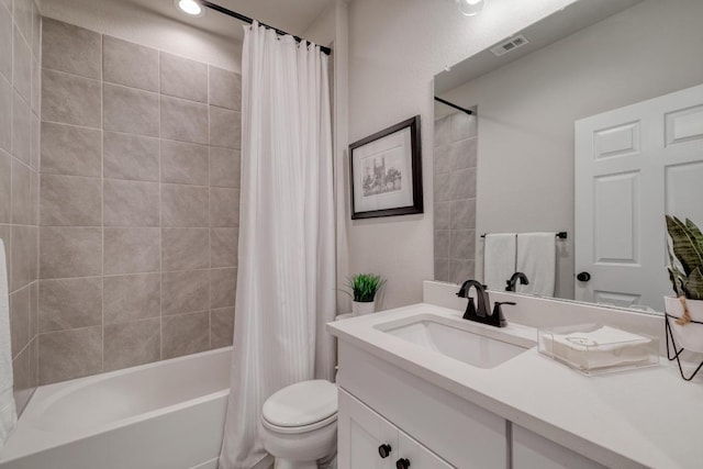 full bathroom with visible vents, toilet, shower / tub combo with curtain, and vanity