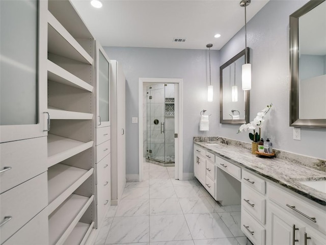 full bathroom featuring visible vents, double vanity, recessed lighting, a stall shower, and marble finish floor