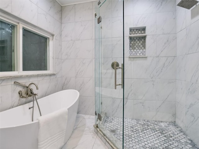 5603 Oakwood Cv Unit 232, Austin, TX 78731 - bathroom featuring a shower stall, a soaking tub, marble finish floors, and tile walls
