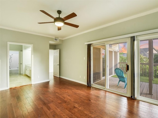 5603 Oakwood Cv Unit 232, Austin, TX 78731 - spare room featuring ceiling fan, dark wood-style flooring, and crown molding