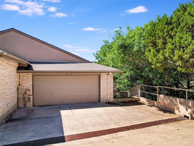 garage with concrete driveway