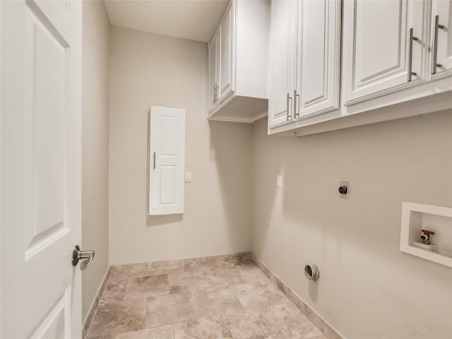 laundry room featuring cabinet space, hookup for an electric dryer, hookup for a washing machine, and baseboards