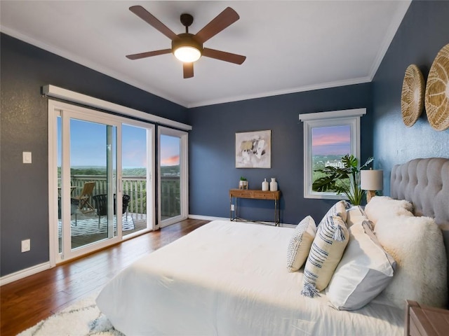 bedroom with a ceiling fan, wood finished floors, crown molding, baseboards, and access to exterior