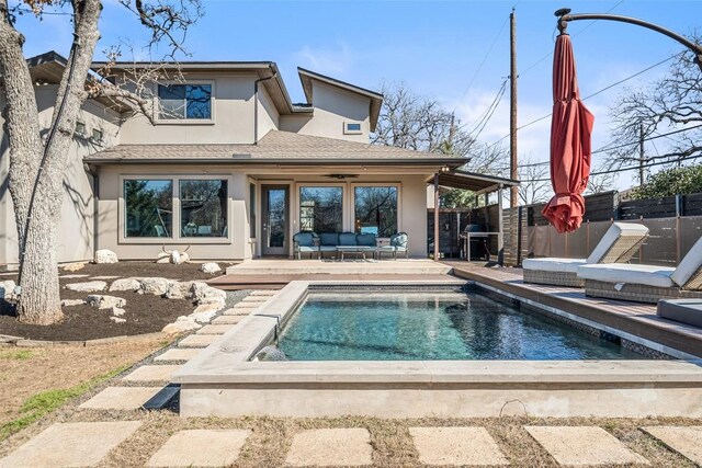 10804 Rush Rd Unit 2, Austin, TX 78732 - rear view of property with stucco siding, an outdoor living space, and a patio