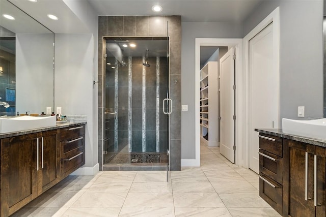 full bath featuring recessed lighting, baseboards, a stall shower, and vanity