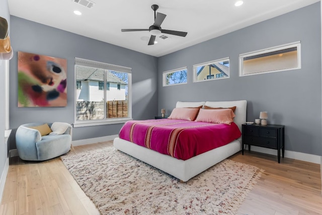 bedroom featuring visible vents, recessed lighting, baseboards, and wood finished floors