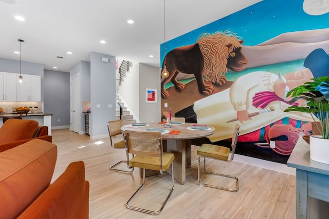 dining room featuring stairway, recessed lighting, light wood-type flooring, and baseboards