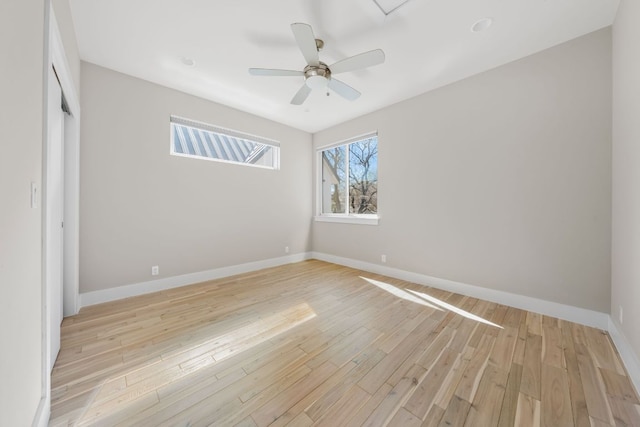 unfurnished bedroom with a closet, light wood-style flooring, baseboards, and ceiling fan