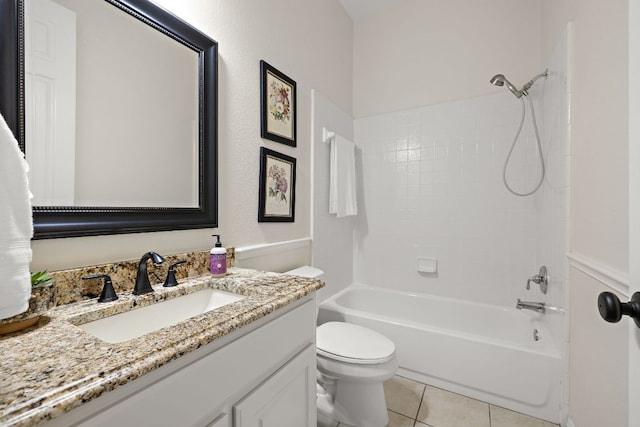 full bath with tile patterned floors, tub / shower combination, toilet, and vanity