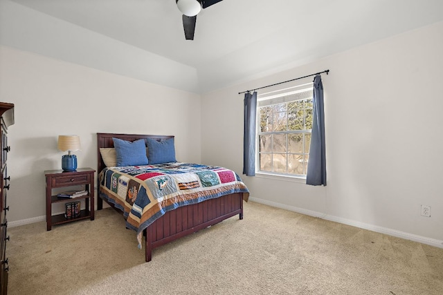 bedroom featuring baseboards, carpet floors, and lofted ceiling