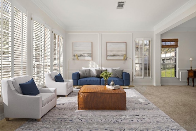 carpeted living area featuring visible vents and ornamental molding