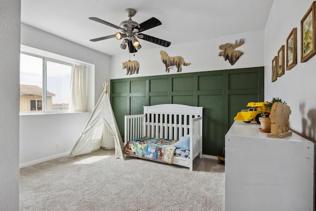 bedroom with carpet flooring, a ceiling fan, and baseboards