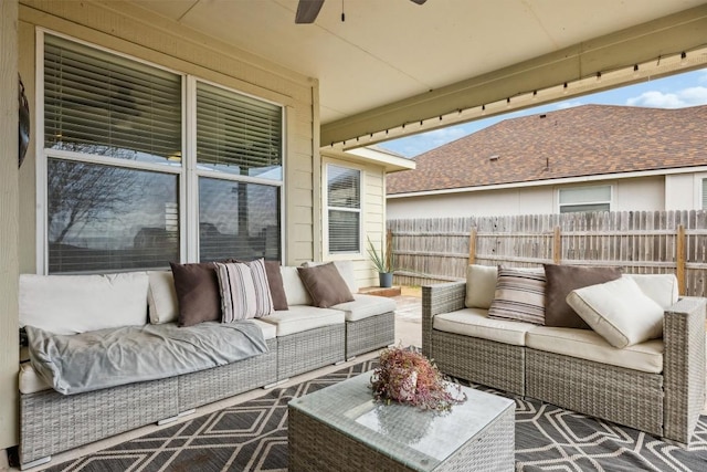 view of patio with an outdoor hangout area, a ceiling fan, and fence