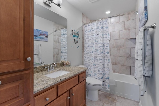 full bathroom with vanity, toilet, visible vents, and shower / bath combo with shower curtain