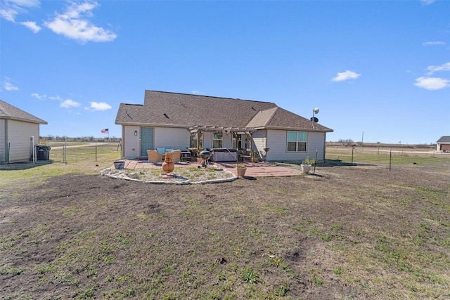 back of property with a yard, a patio, fence, and a pergola