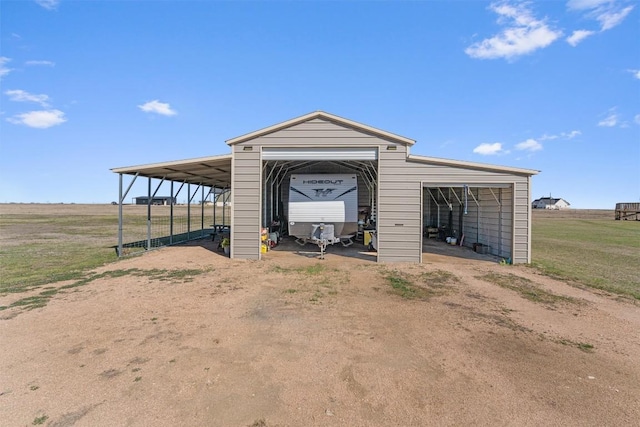 view of outbuilding with an outdoor structure and dirt driveway