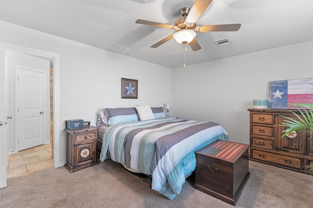 bedroom with visible vents, a ceiling fan, and carpet floors