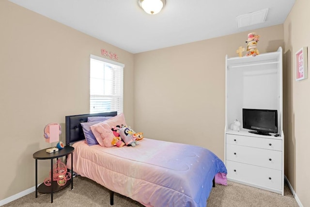 bedroom with visible vents, carpet flooring, and baseboards