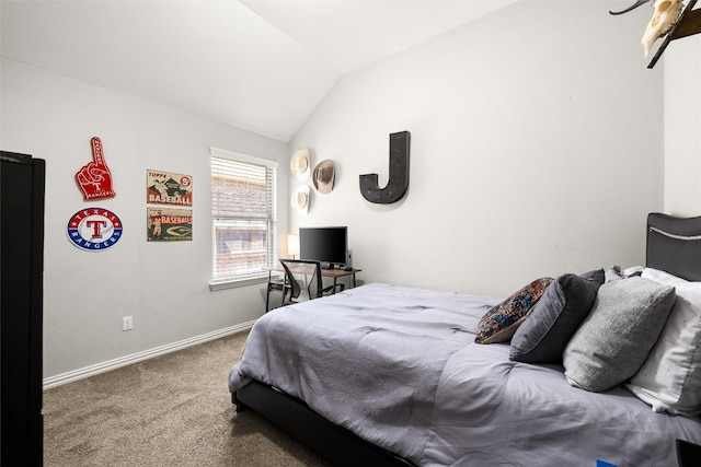 bedroom featuring baseboards, lofted ceiling, and carpet floors