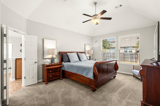 bedroom with lofted ceiling, carpet, visible vents, and baseboards