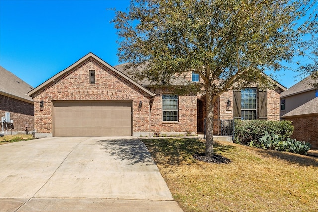 view of front facade with concrete driveway, brick siding, a garage, and a front lawn