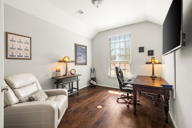 office area featuring visible vents, lofted ceiling, baseboards, and wood finished floors