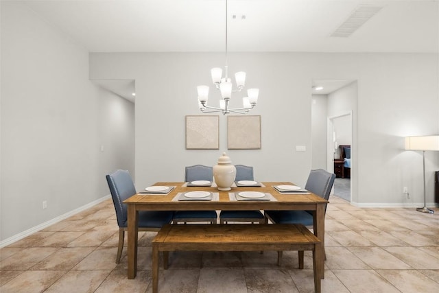 dining area with an inviting chandelier, light tile patterned floors, visible vents, and baseboards