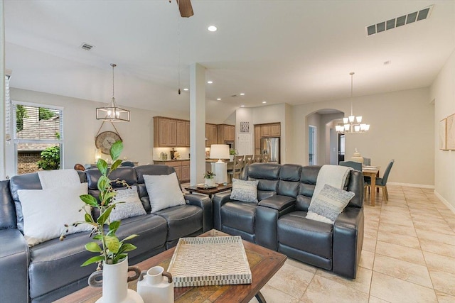 250 Nantucket Cir, Austin, TX 78737 - living area with arched walkways, a chandelier, baseboards, recessed lighting, and light tile patterned flooring