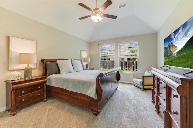bedroom featuring light colored carpet, visible vents, vaulted ceiling, ceiling fan, and baseboards